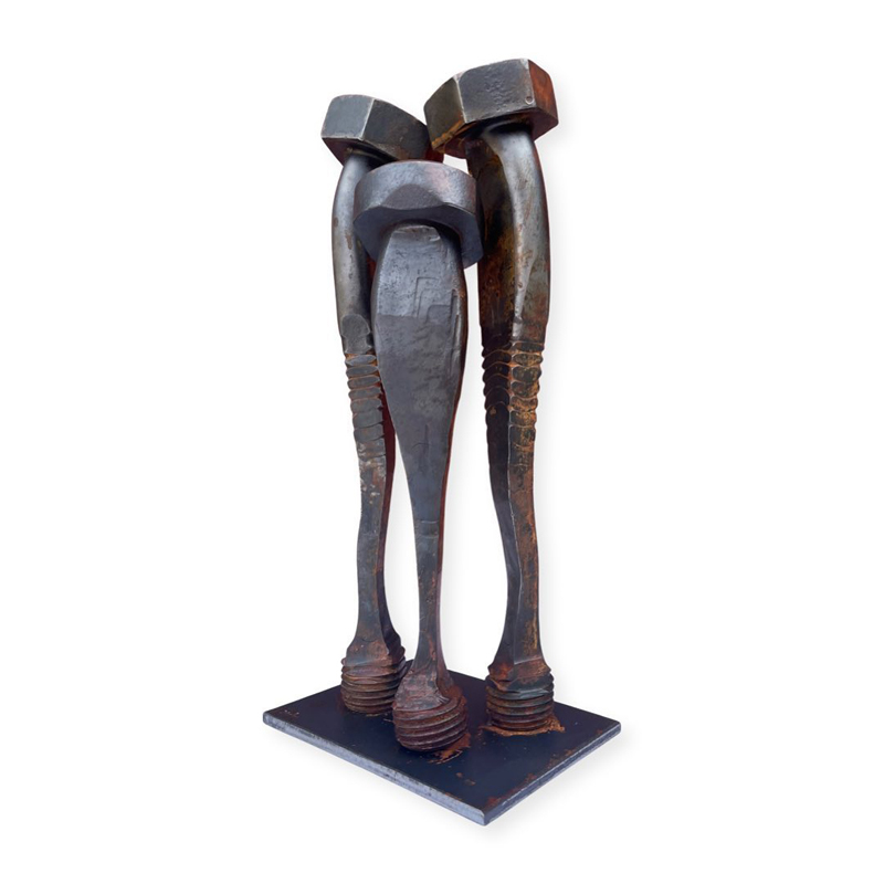 Three nails standing together