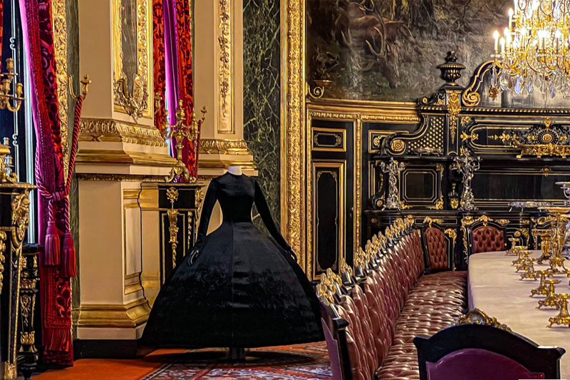 Simple black dress at the Fashion Exhibition at the Louvre Museum