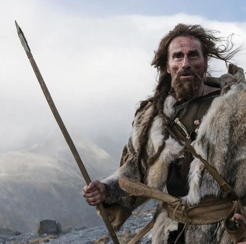 A man in prehistoric clothing; Photo source: faircompanies; Name of the photographer: unknown