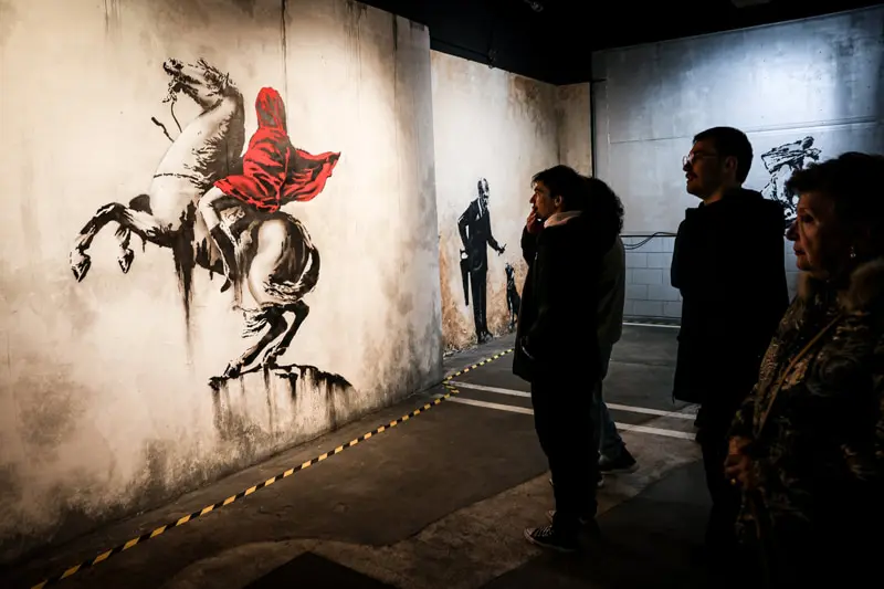 Equestrian painting with red cape; Banksy's effect