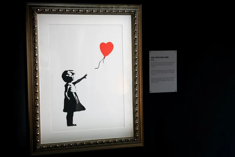 Painting the girl and the balloon in the frame; Banksy's effect
