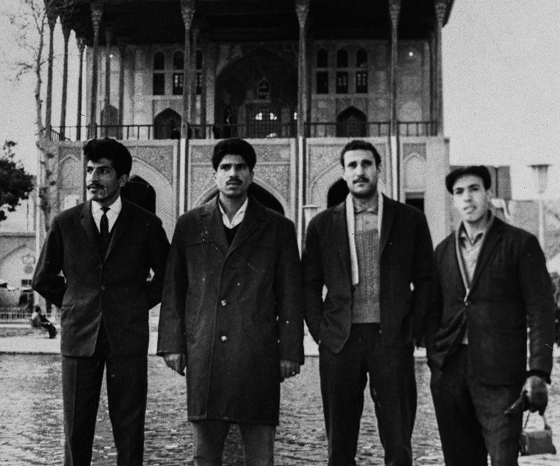 Black and white photo of four men in ancient Iran