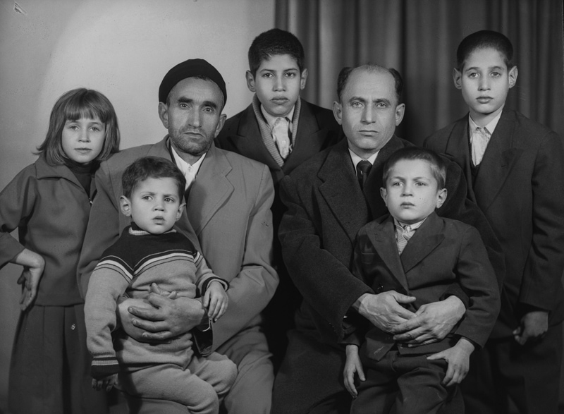 Black and white photos of fathers and children in ancient Iran