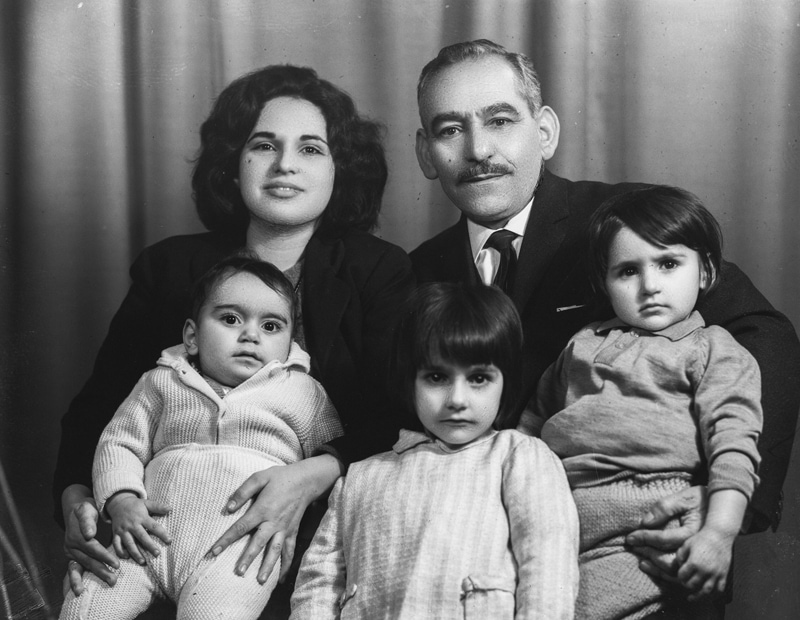 Old Iranian couple's black and white photo and three young children