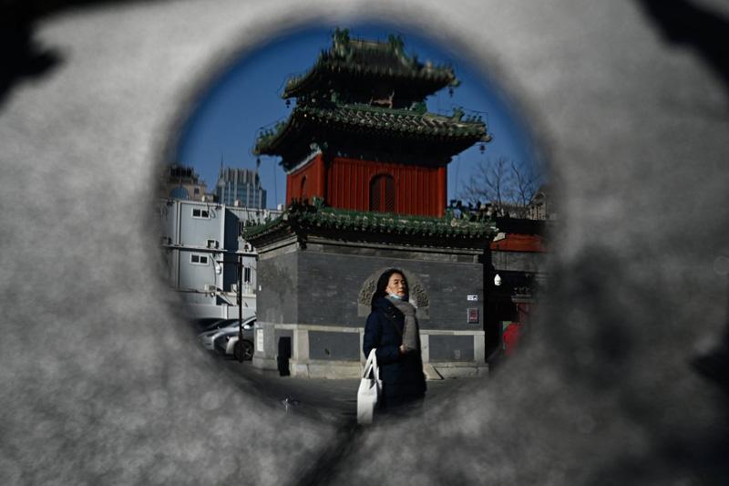 A picture of the temple of Beijing's Dongyue in the mirror; Photo Source: Theguardian; Photographer Name: Pardro Pardo