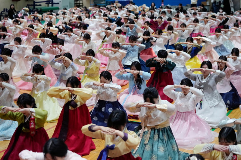   Joint Graduate High School Graduate Ceremony in Seoul, South Korea; Photo Source: Theguardian; Photographer Name: AHN Young-Joon