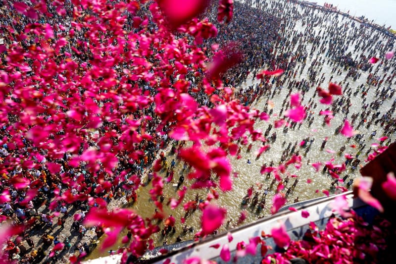 People's flowers in the great and religious celebration of Maha Kumbh Festival (MAHA KUMBH FESTIVAL) in India; Photo Source: Theguardian; Photographer Name: Rajesh Kumar Singh