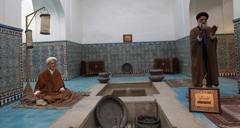 The statue of two clerics in the bathroom of Ganjali Khan Kerman; Photographer: Mohammad Shojaee