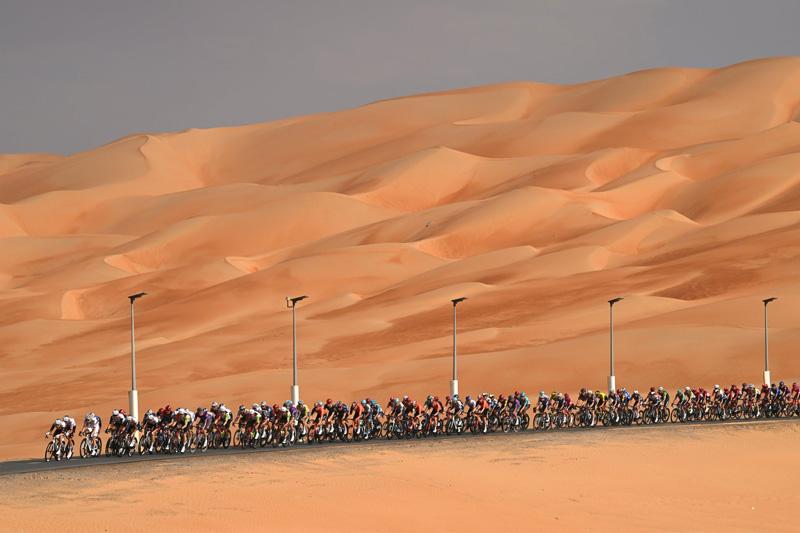 Cyclists at the stage of one of the seventh UAE Tour; Photo Source: Theguardian; Photographer Name: Dario Belingheri