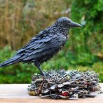 Crow statue with recycled materials