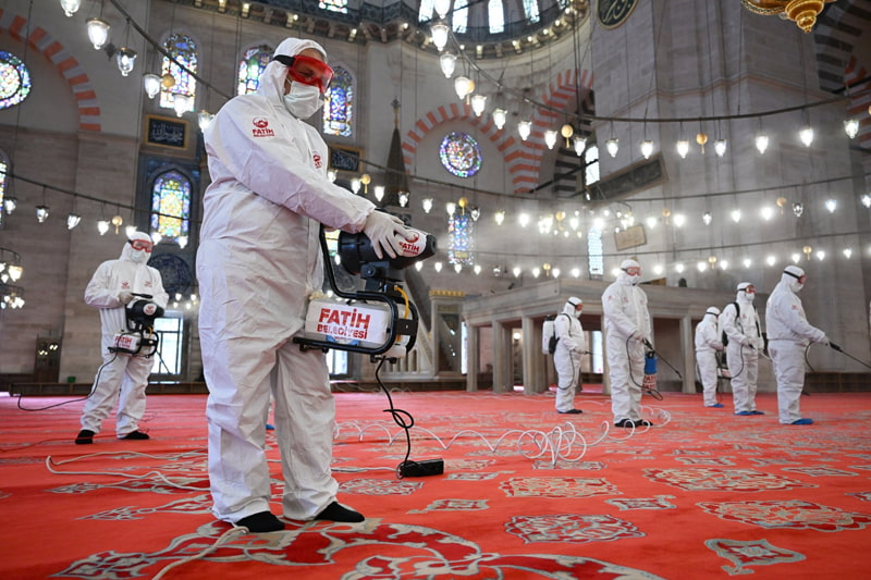 Workers disinfect Istanbul Mosque before the holy month of Ramadan; Photo Source: Theguardian; Photographer Name: Mehmet Murat Onel