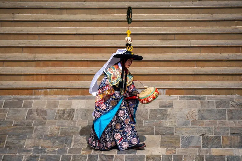 Traditional Dance of a Buddhist Monk in Nepal as part of the New Year's Eve Celebration (SHERPA); Photo Source: Theguardian; Photographer Name: Niranjan Shrestha