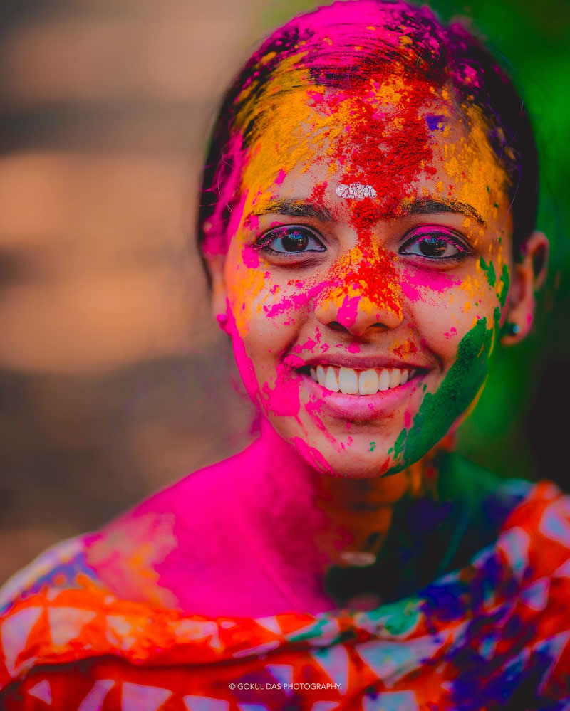 Hindi woman with a painted face at the Holi celebration 