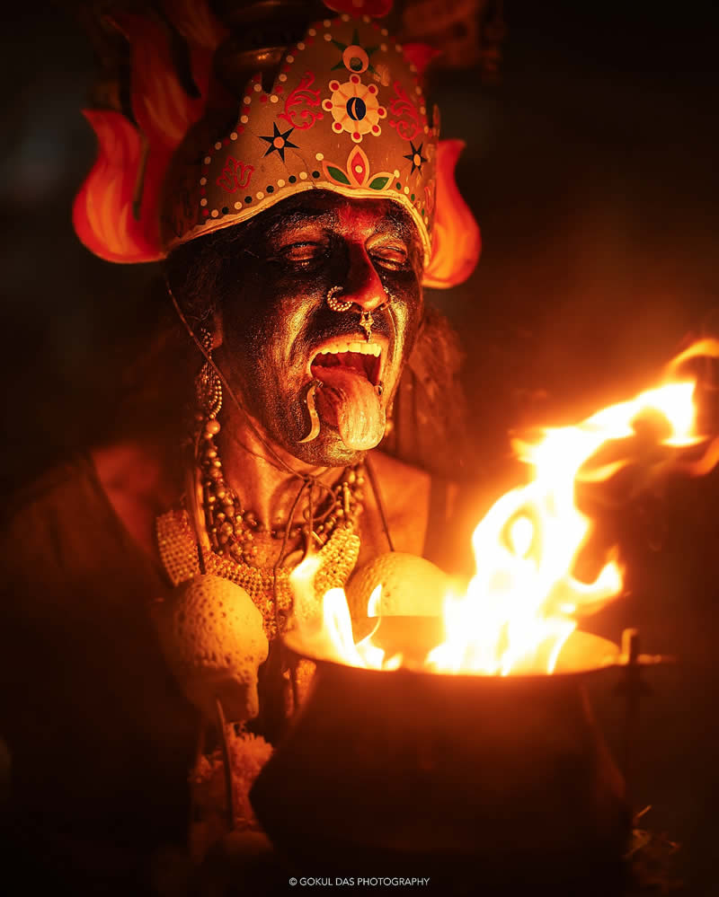 Indian man on the side of the fire container