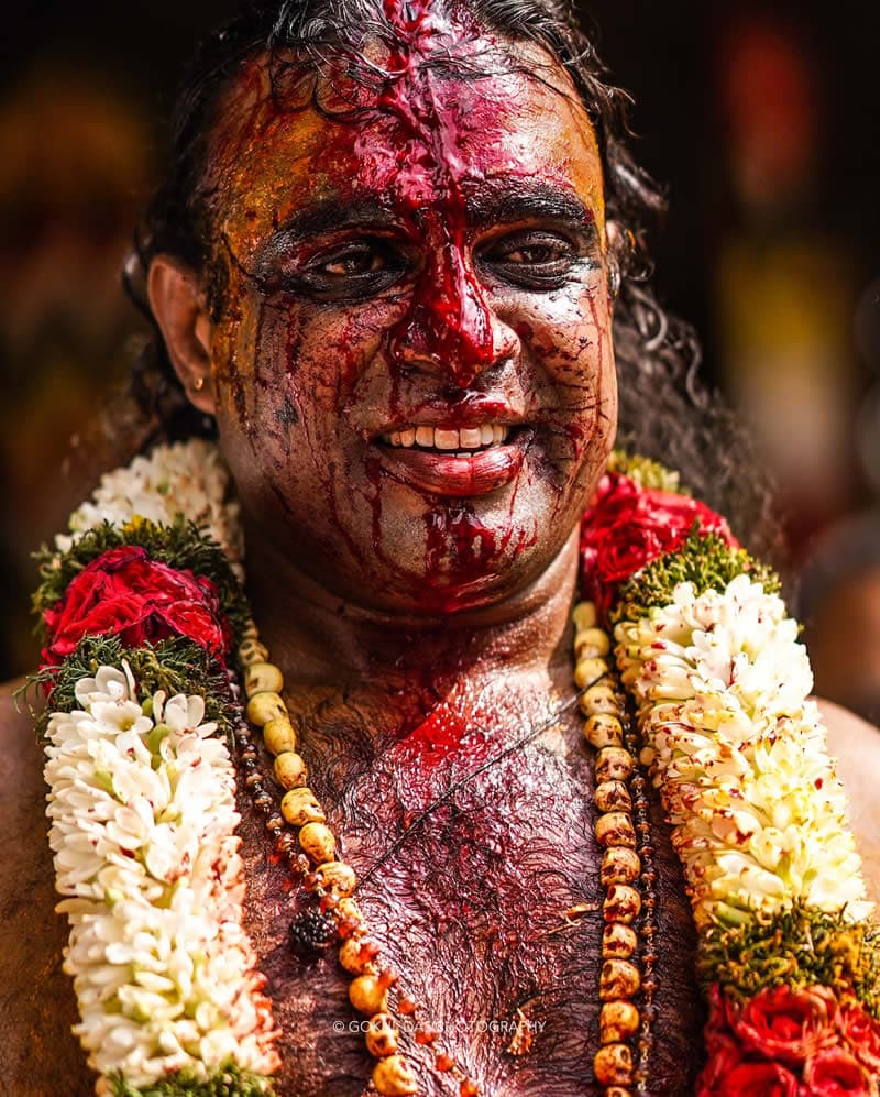 A man with colored face at the traditional Indian festival 