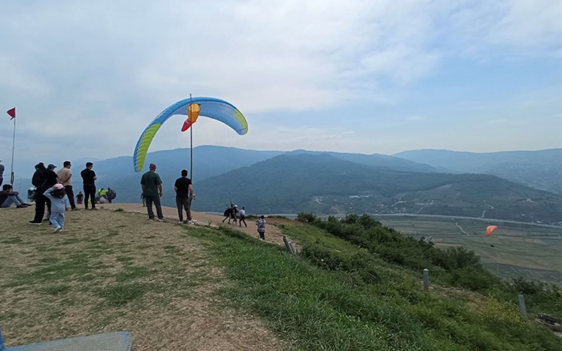 Paragliders at the site