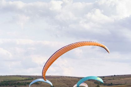 Landing paragliders on the grass ground in Kalardasht