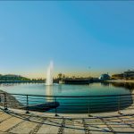 The metal fences around a small lake