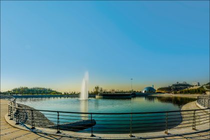 The metal fences around a small lake