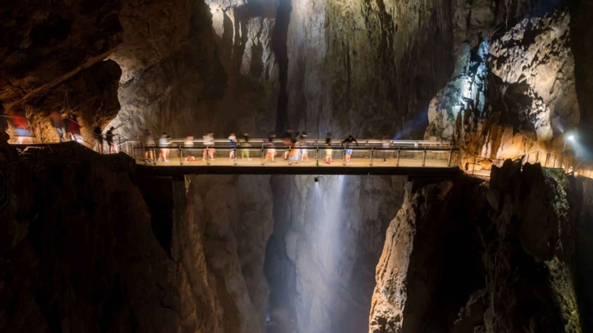 Tourists' traffic on the bridge in Akotsian cave