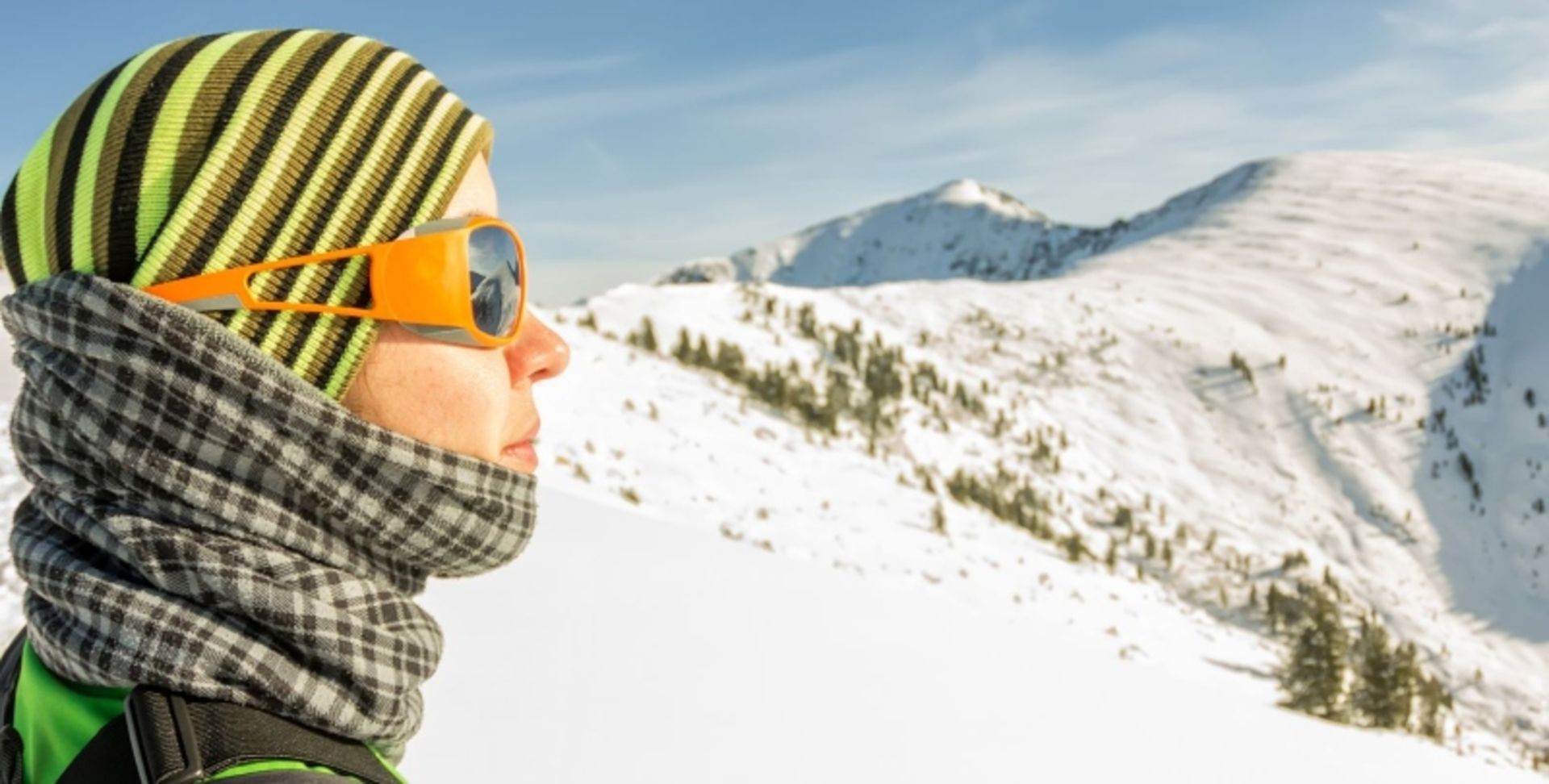 Tourist Woman with Scarf in Snowy Mountain