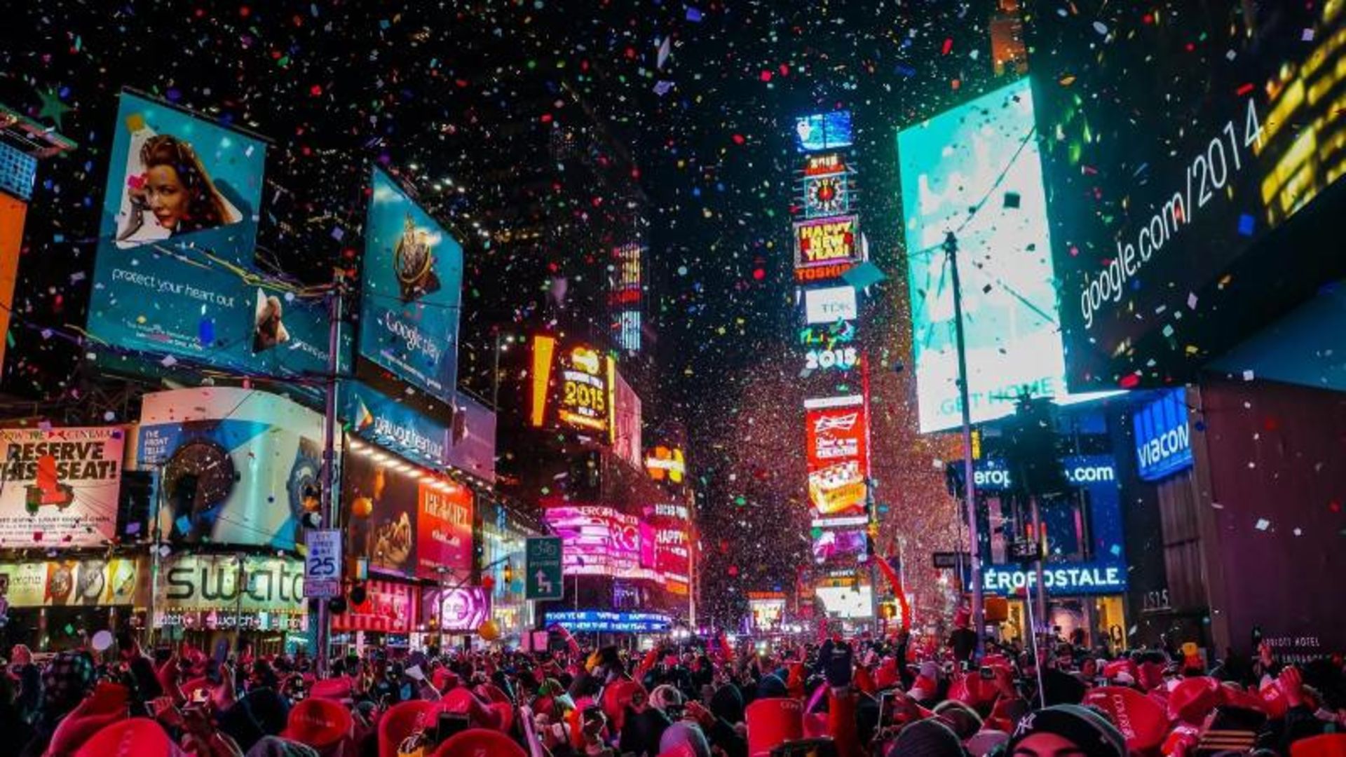 Tourists in Times Square at night