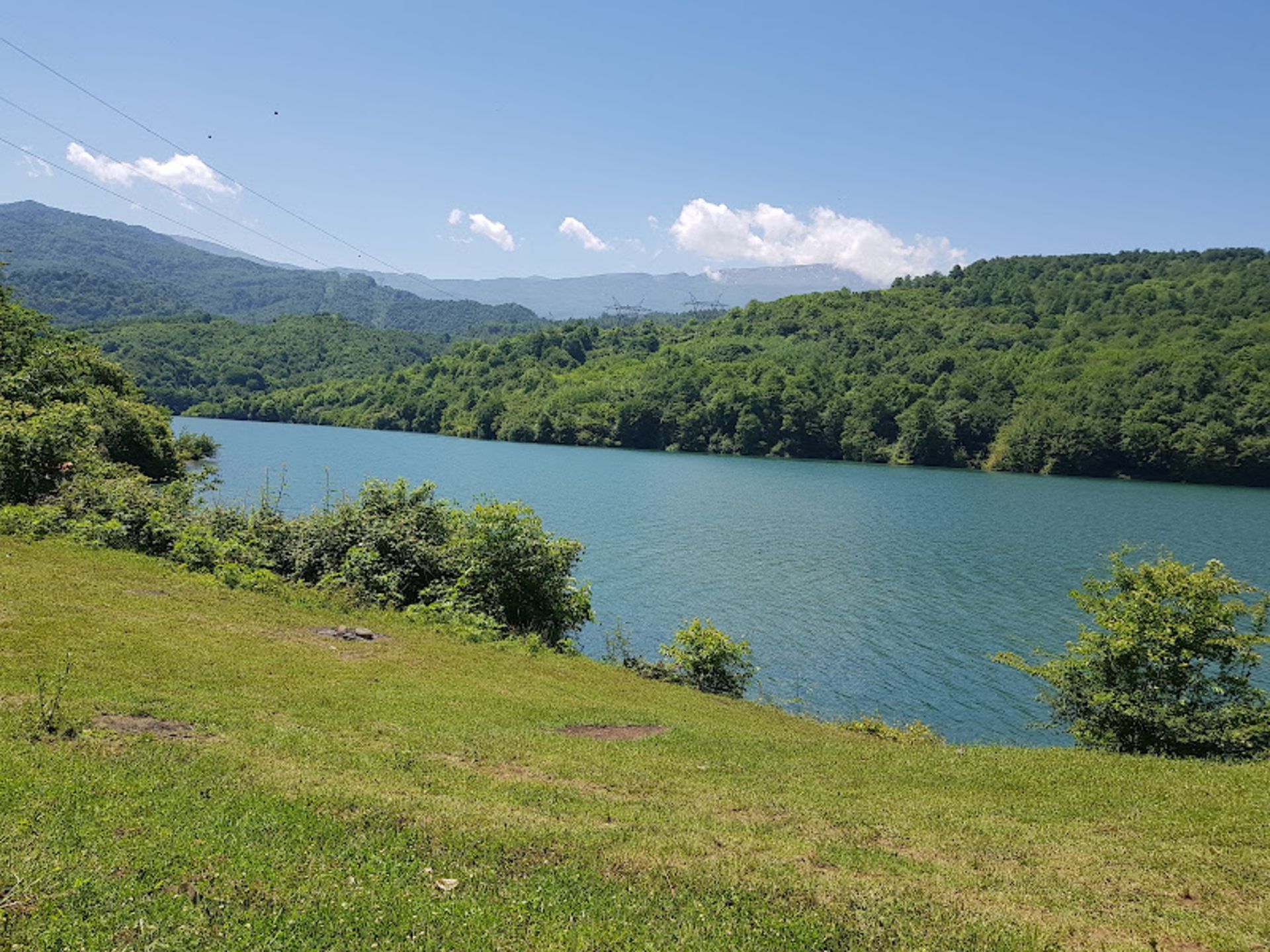 Lefor Dam with a flat sky and lush nature