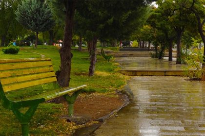 Yasuj Beach Park bench in the rain