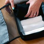 Towel and travel sheets in the suitcase