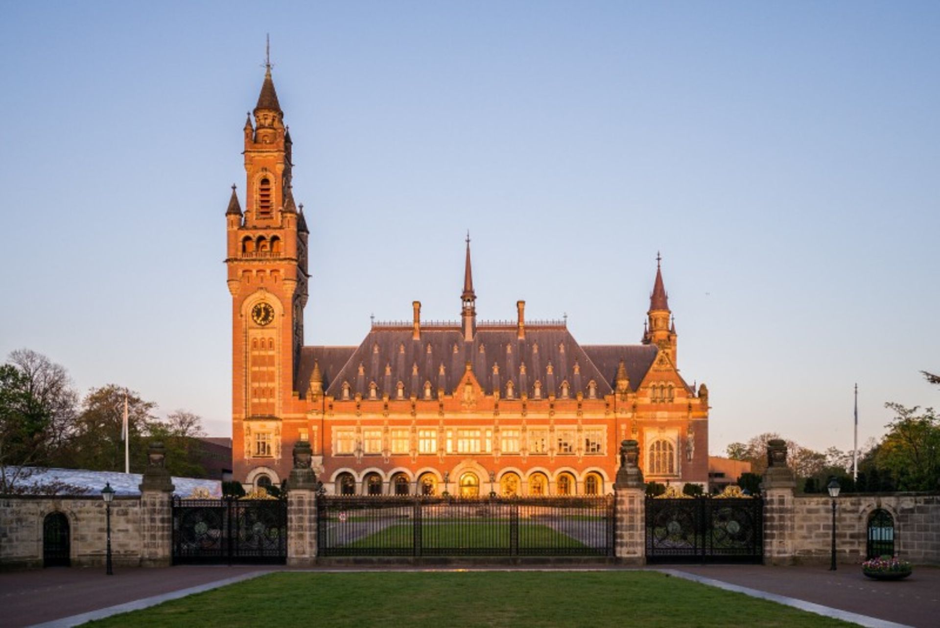 Building of the International Court of Justice of the Hague on sunny day and green space 