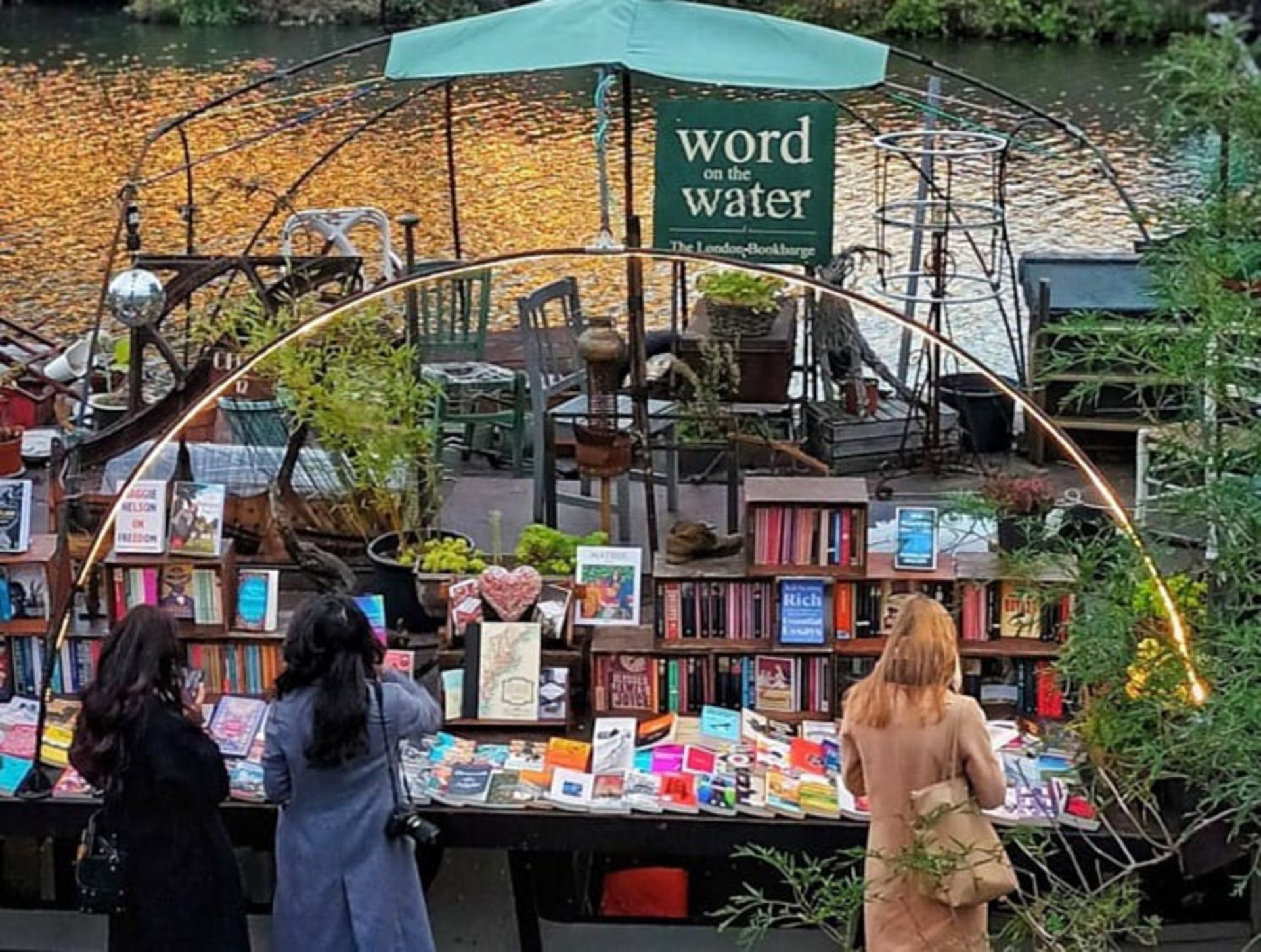 Word's Word Boach with Bookstore Shelves and Customers Watching