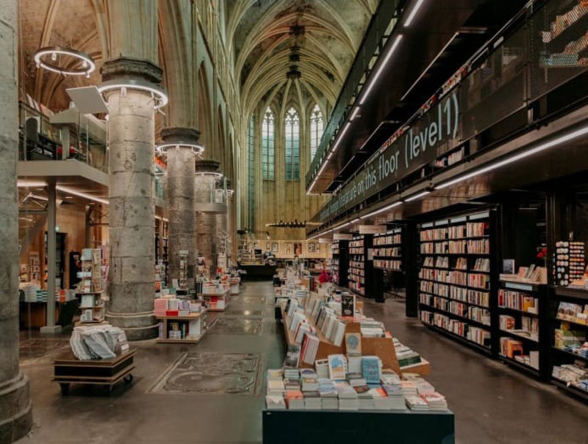 Dominican Bookstore Interior with Stone Pillars and Gothic High Ceiling 