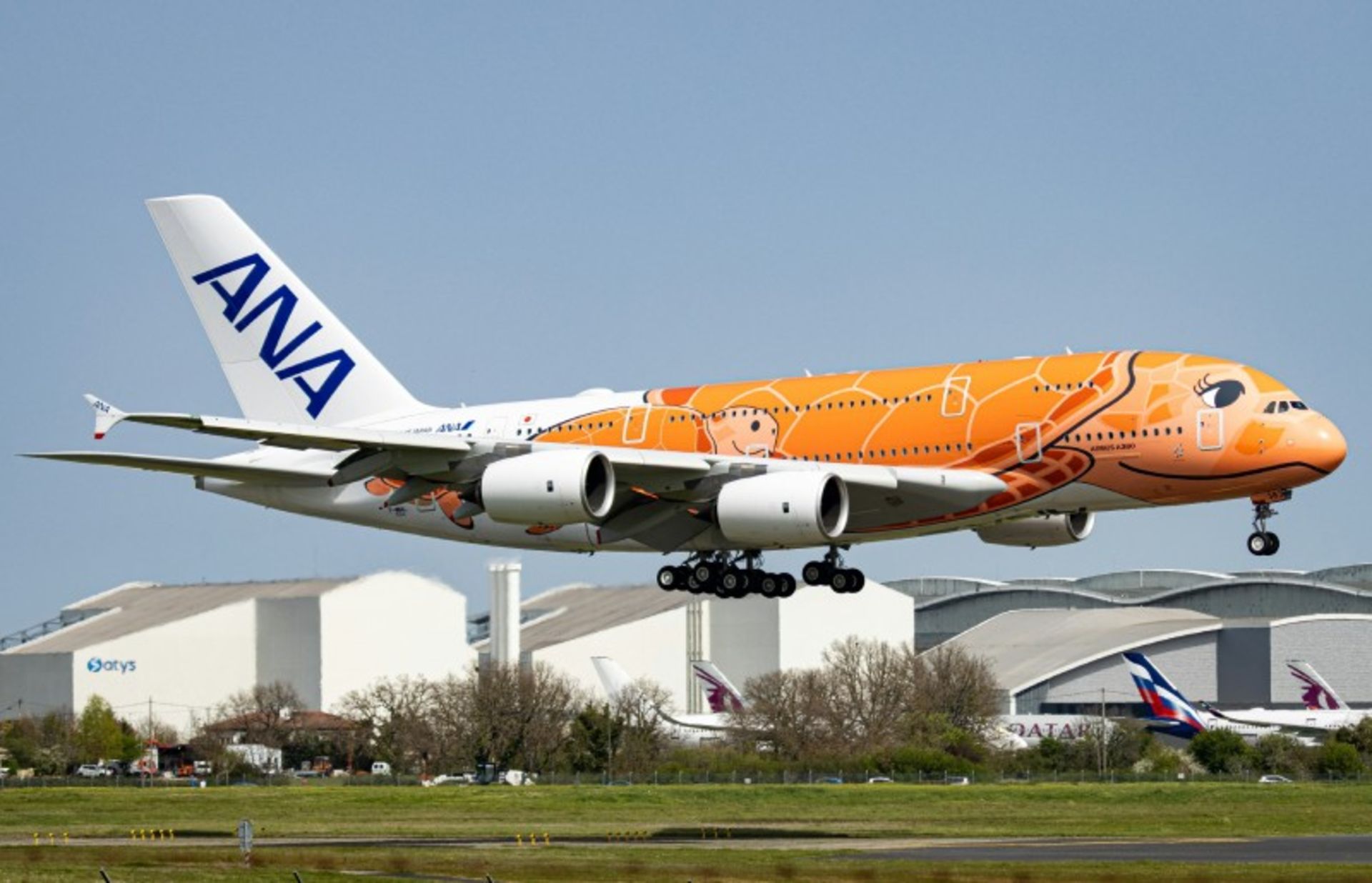 Al -Nippon Airways Orange and White Airlines at the Airport