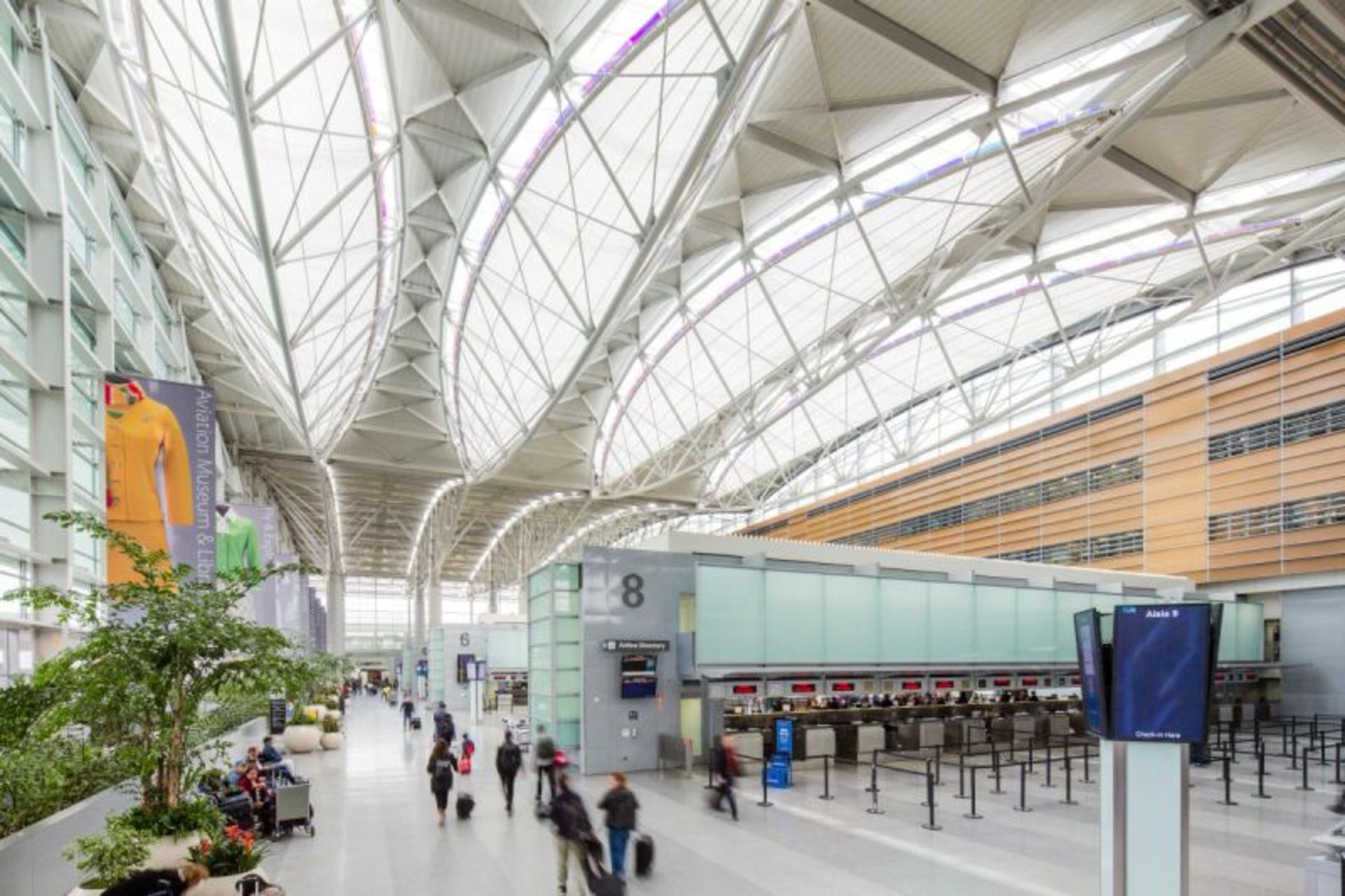 Passengers indoors in the interior of San Francisco International Airport 