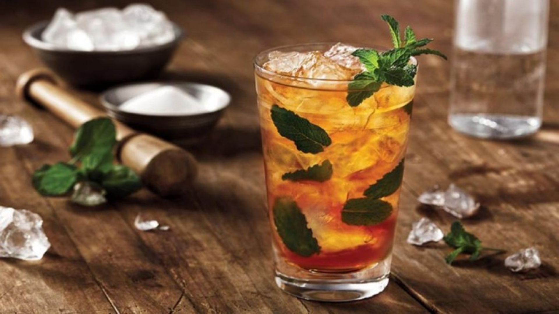 A glass of mint -made syrup with ice