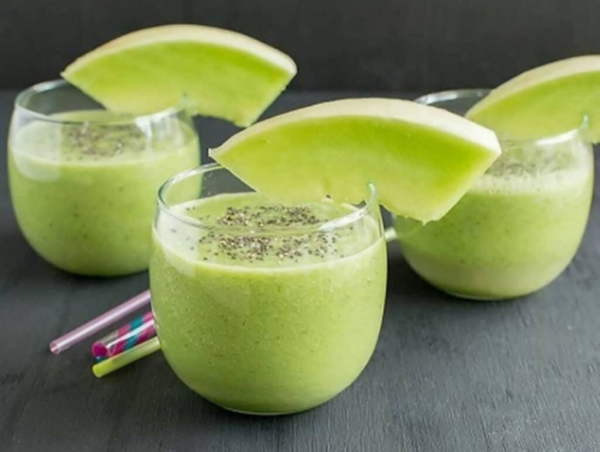 Three glasses of milkshake with cantaloupe