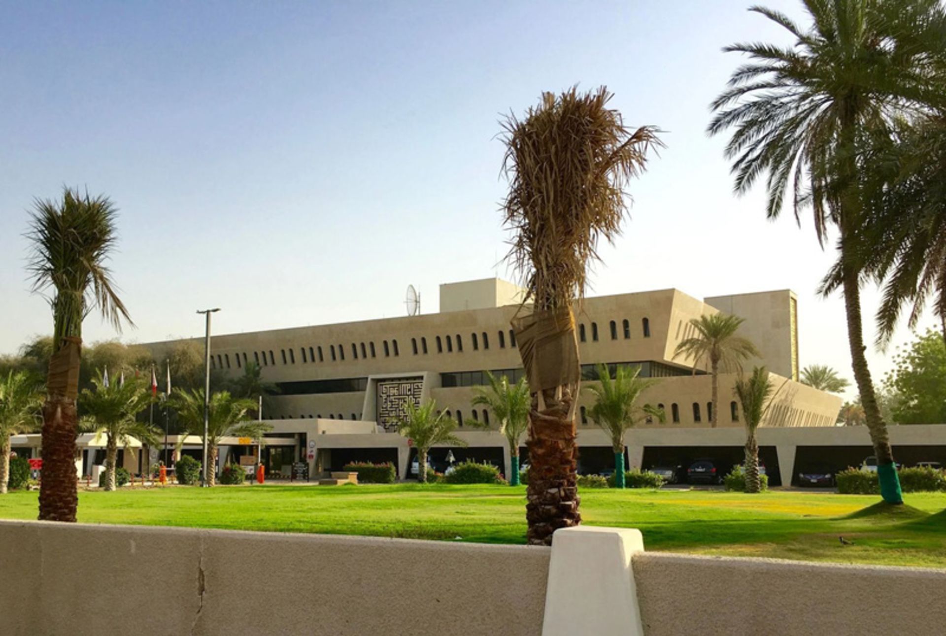 Dubai oil building with palm trees