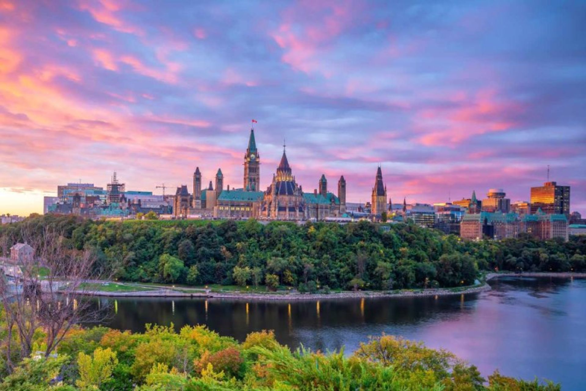 Canadian Parliament Building by River and Trees in Ottawa