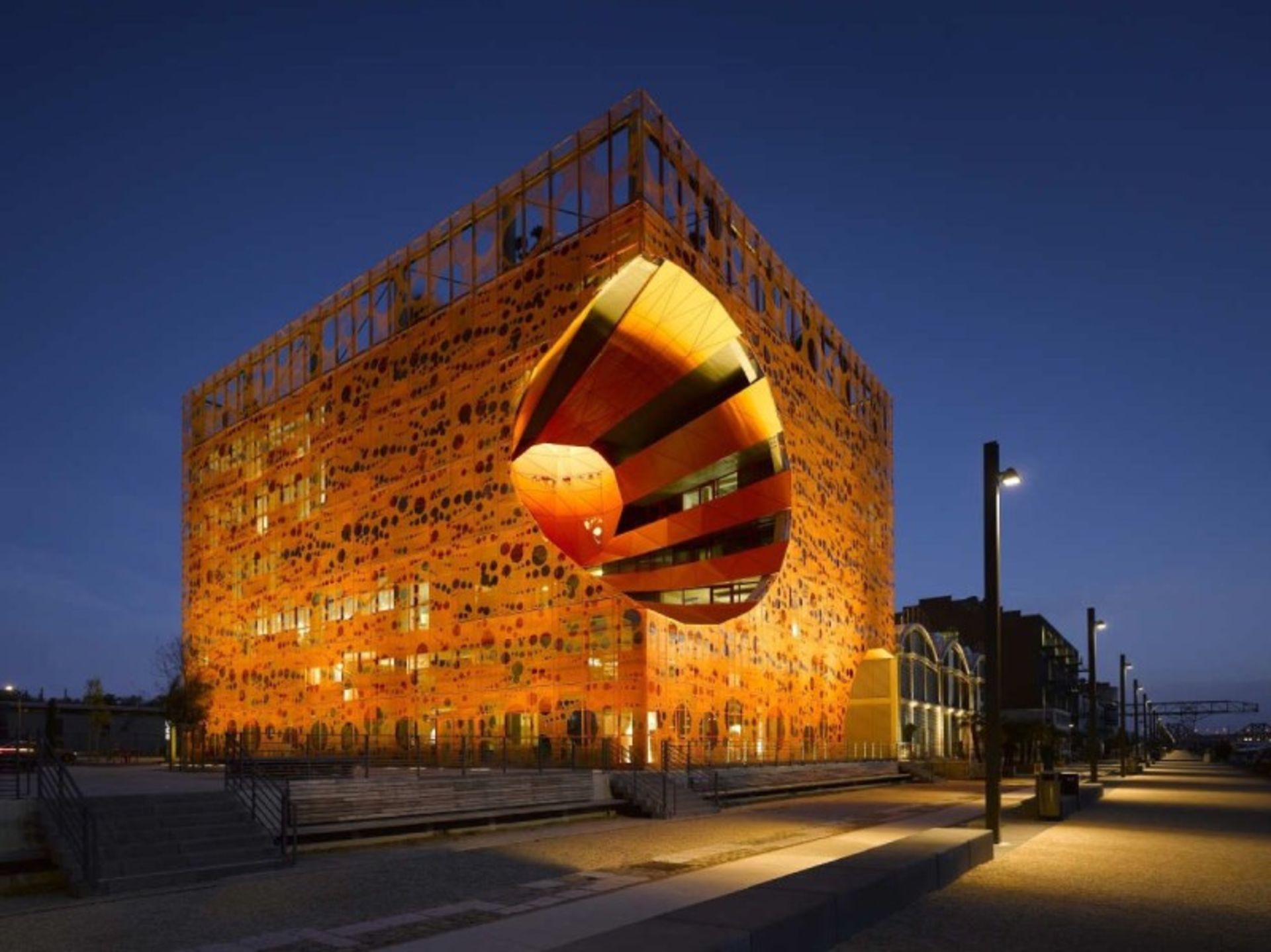 Lighting of Orange Cube Building at Night