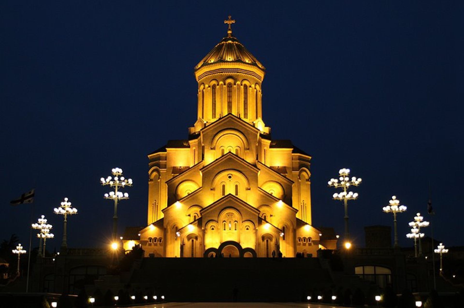 The yellow lighting of the holy church of the Trinity in the night