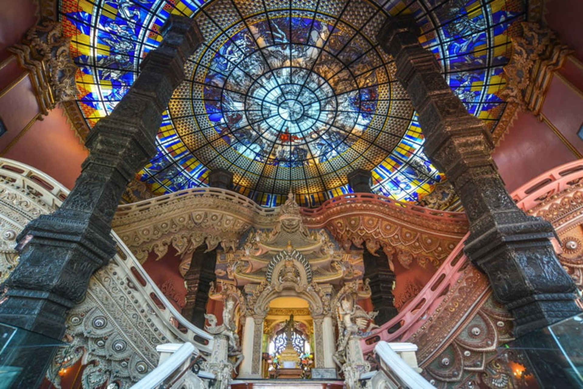 Ceiling of colored glass and tall columns of the Museum in Thailand