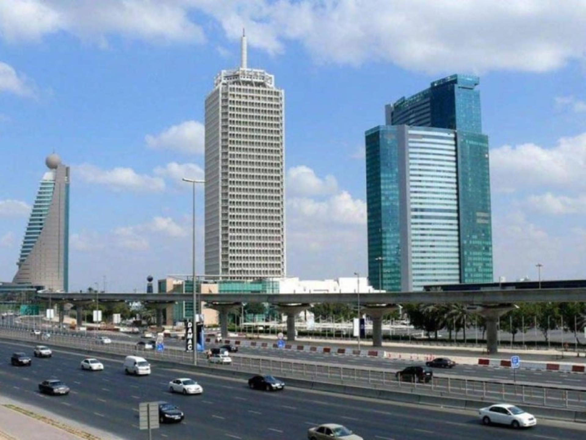 Dubai World Trade Center building and modern buildings surrounding it