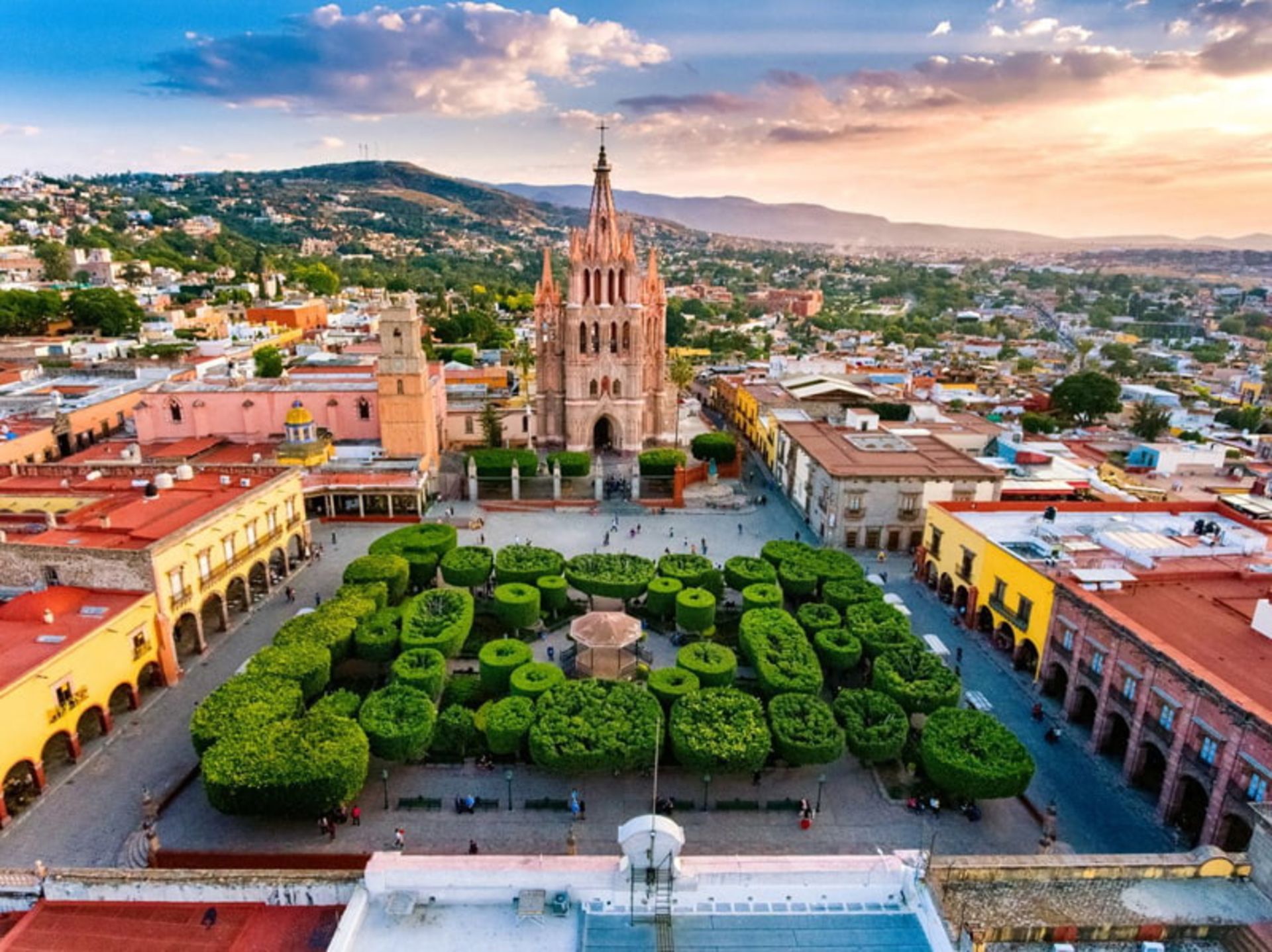 Aerial facade of the St. Miguel de Alland Cathedral and Green Square opposite it in Mexico