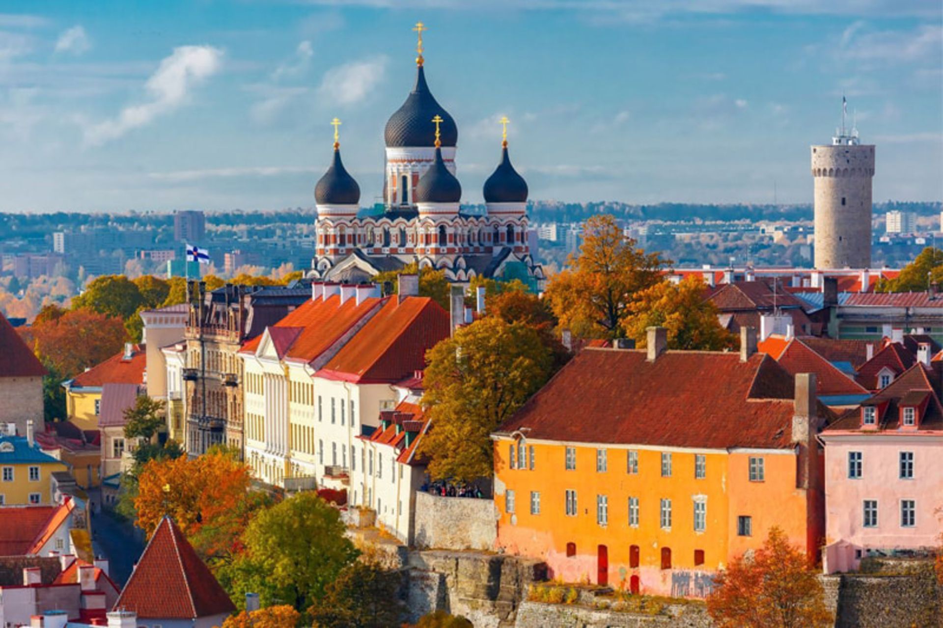 Alexander Nosky Cathedral with bulb domes and historic buildings with orange brick ceilings in Tallinn