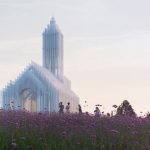 Tourists next to the shadowed church