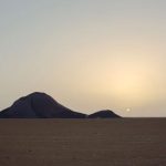 Monolite bin Amirah in the Great Sahara of Africa at sunset