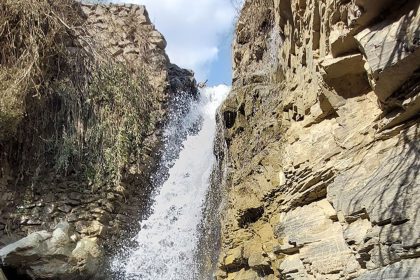 Male tourist alongside Siban Dara waterfall