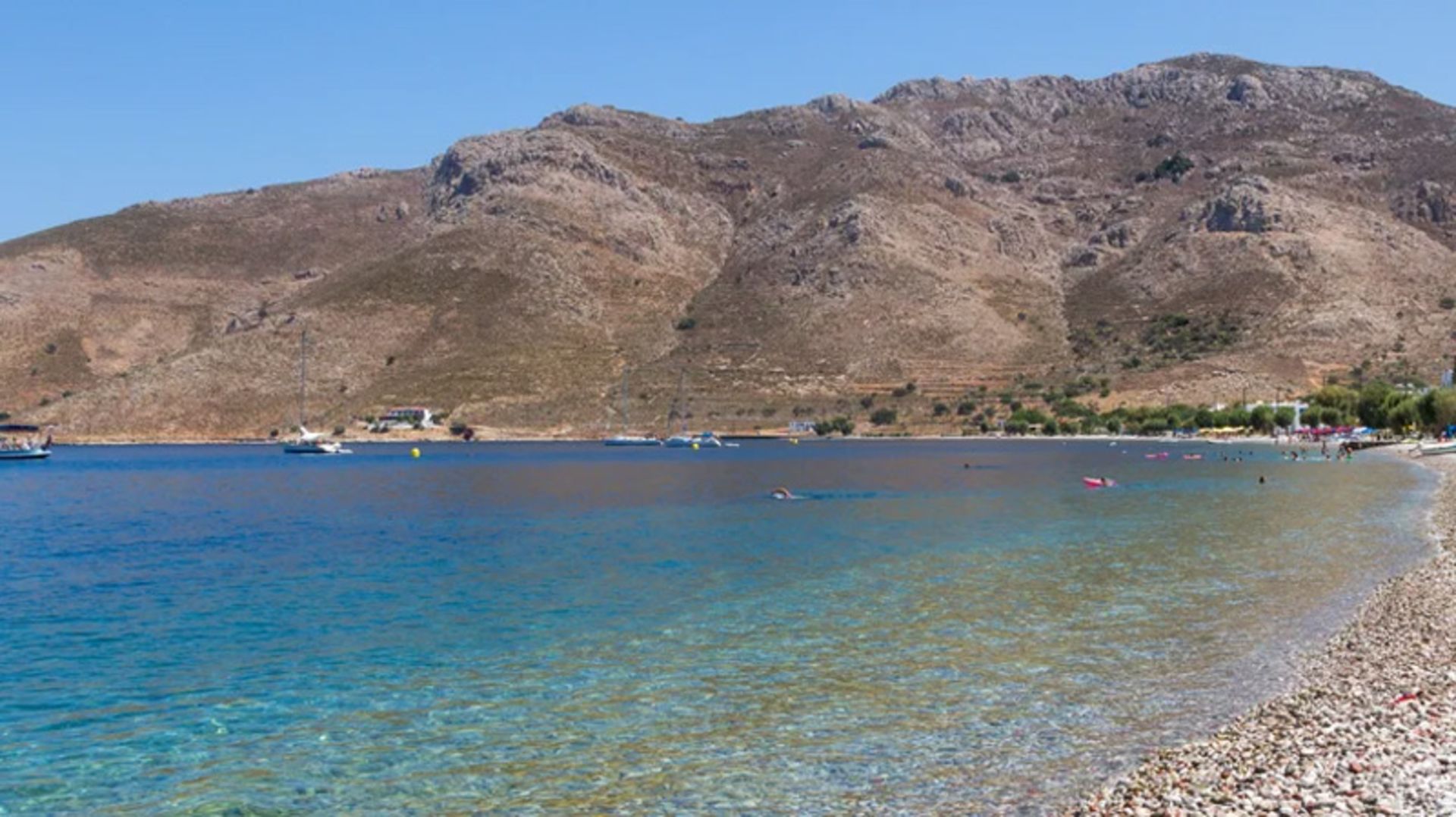 Clean beach with a transparent sea on Tilos Island