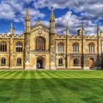 Cambridge University building and green space on sunny day