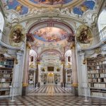 The interior of the magnificent Library of Adammine Monastery with a painted roof and Baroque architecture